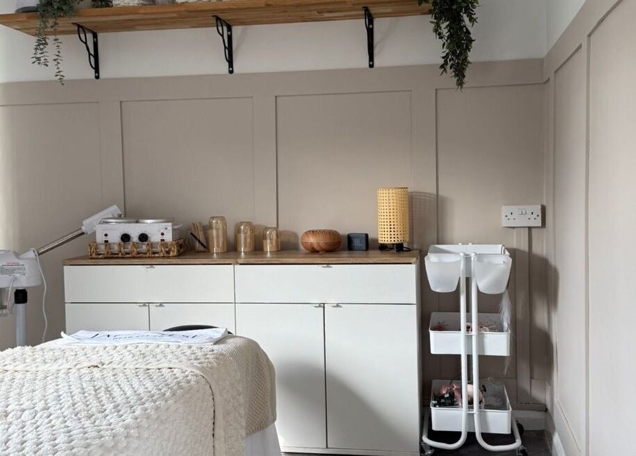 Relaxing treatment room at Skin Perfected Ferring, Ferring, England, GB, featuring cozy interiors and soft lighting.