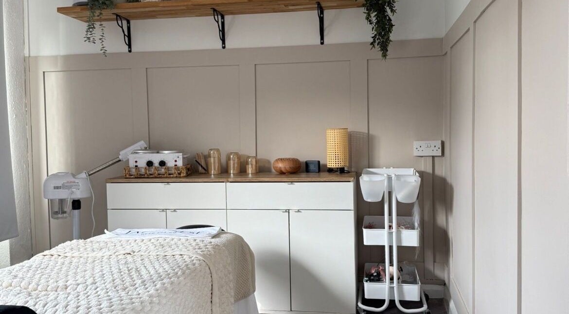 Relaxing treatment room at Skin Perfected Ferring, Ferring, England, GB, featuring cozy interiors and soft lighting.