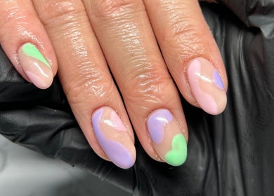 Pastel swirl nail art by Fliss Beauty, Clitheroe, England, GB. Featuring pink, purple, and green shades.
