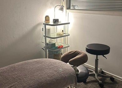 Serene therapy room at Northern Rivers Therapy in Ballina, New South Wales, AU, with a massage table and supplies.