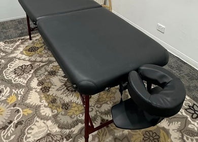 Massage table at Northern Rivers Therapy in Ballina, New South Wales, AU with intricate floral rug.