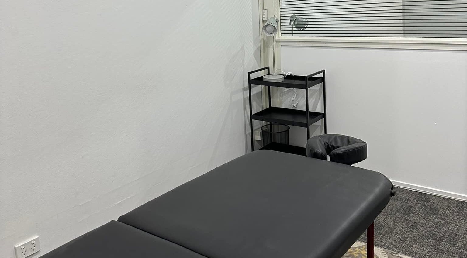 Northern Rivers Therapy's serene treatment room in Ballina, New South Wales, AU, featuring a massage table.