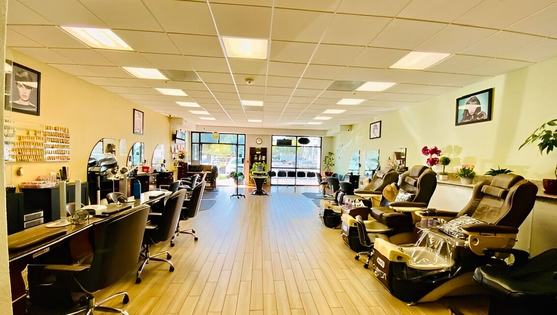 Spacious interior of Amazing Cuts in Sunnyvale, California with luxury seating and modern decor.