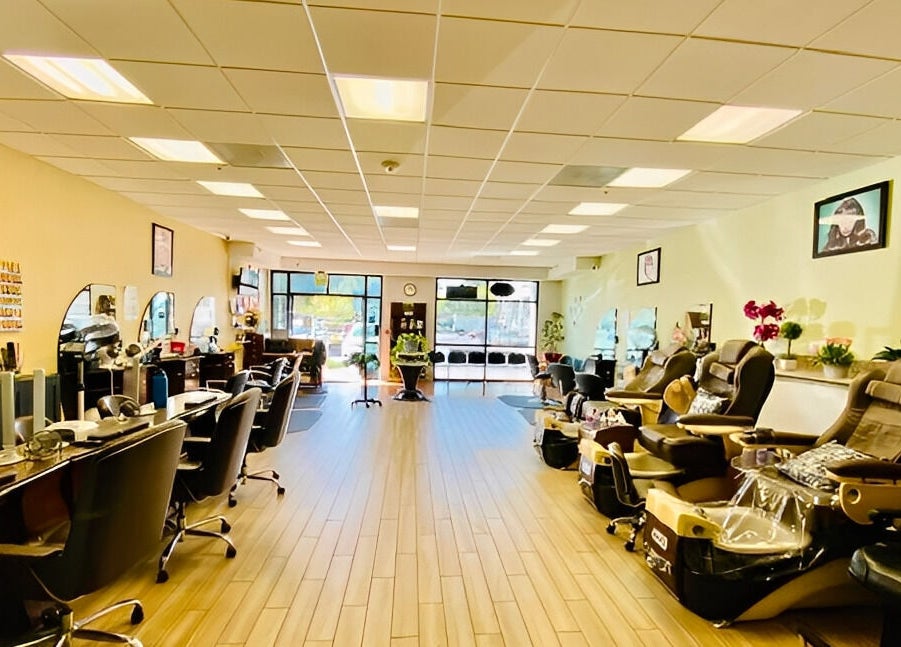 Spacious interior of Amazing Cuts in Sunnyvale, California with luxury seating and modern decor.