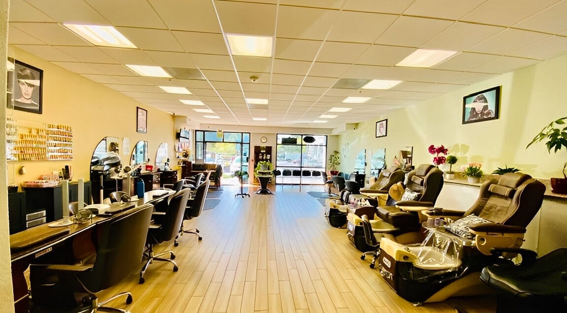 Spacious interior of Amazing Cuts in Sunnyvale, California with luxury seating and modern decor.