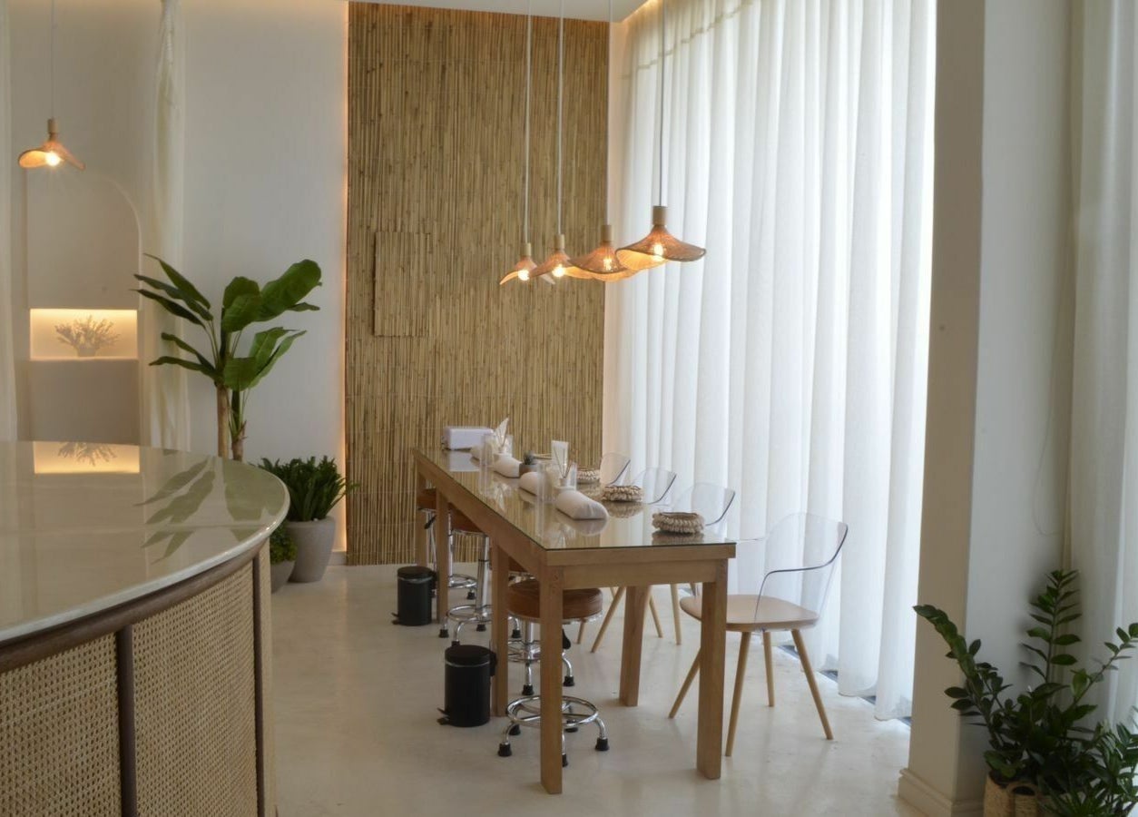 Chic interior of Cuteicles Nail Spa, Riyadh with natural elements and elegant seating.