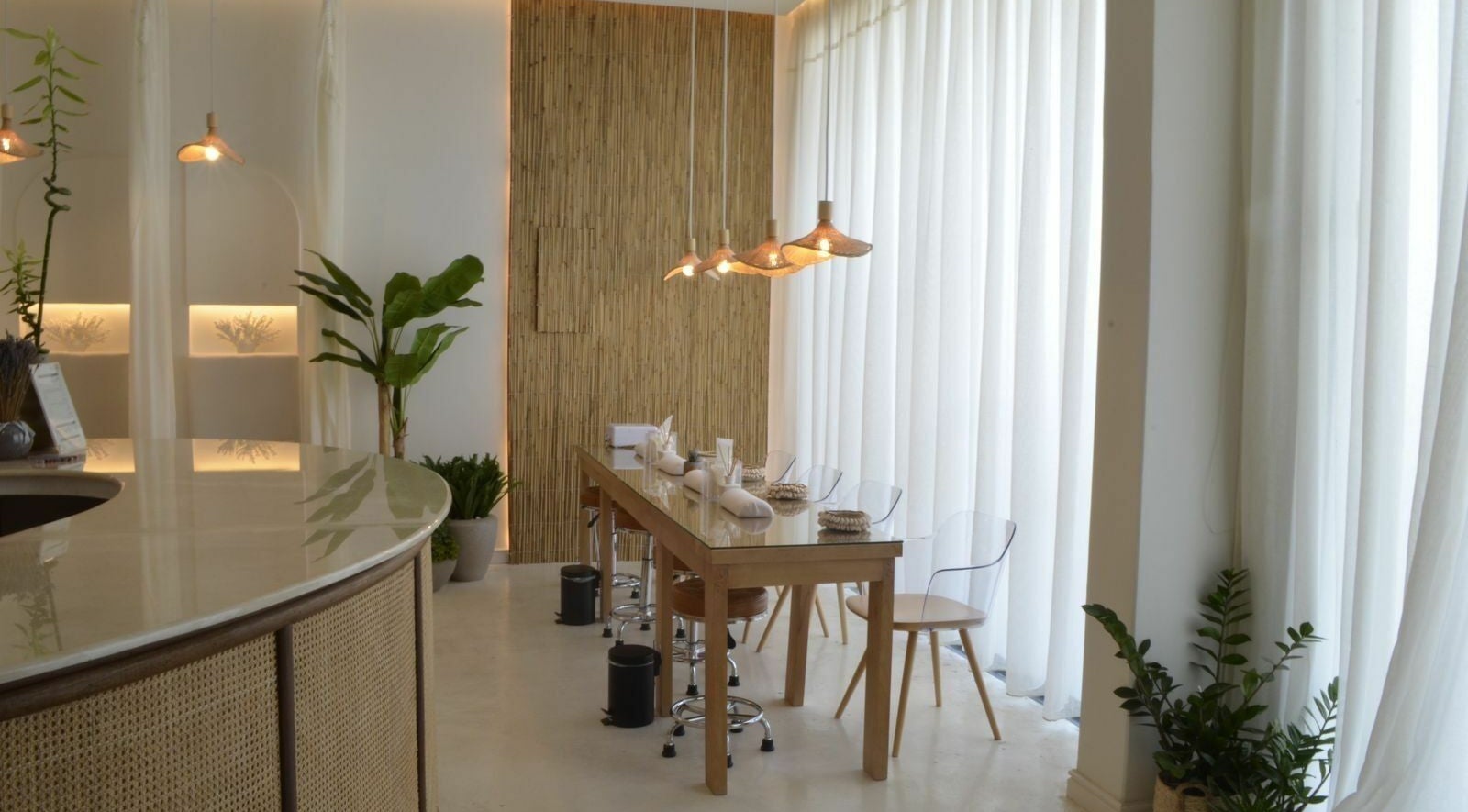 Chic interior of Cuteicles Nail Spa, Riyadh with natural elements and elegant seating.