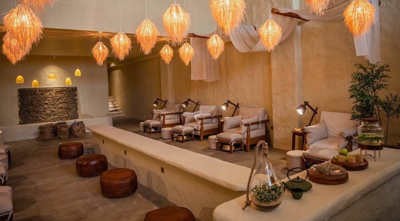 Cozy lounge area at Verve Spa Alrabi, Riyadh, Riyadh Province, SA, featuring plush seating and warm lighting.