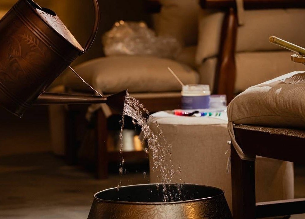 A serene spa setting at Verve Spa Alrabi, Riyadh with water pouring into a basin.