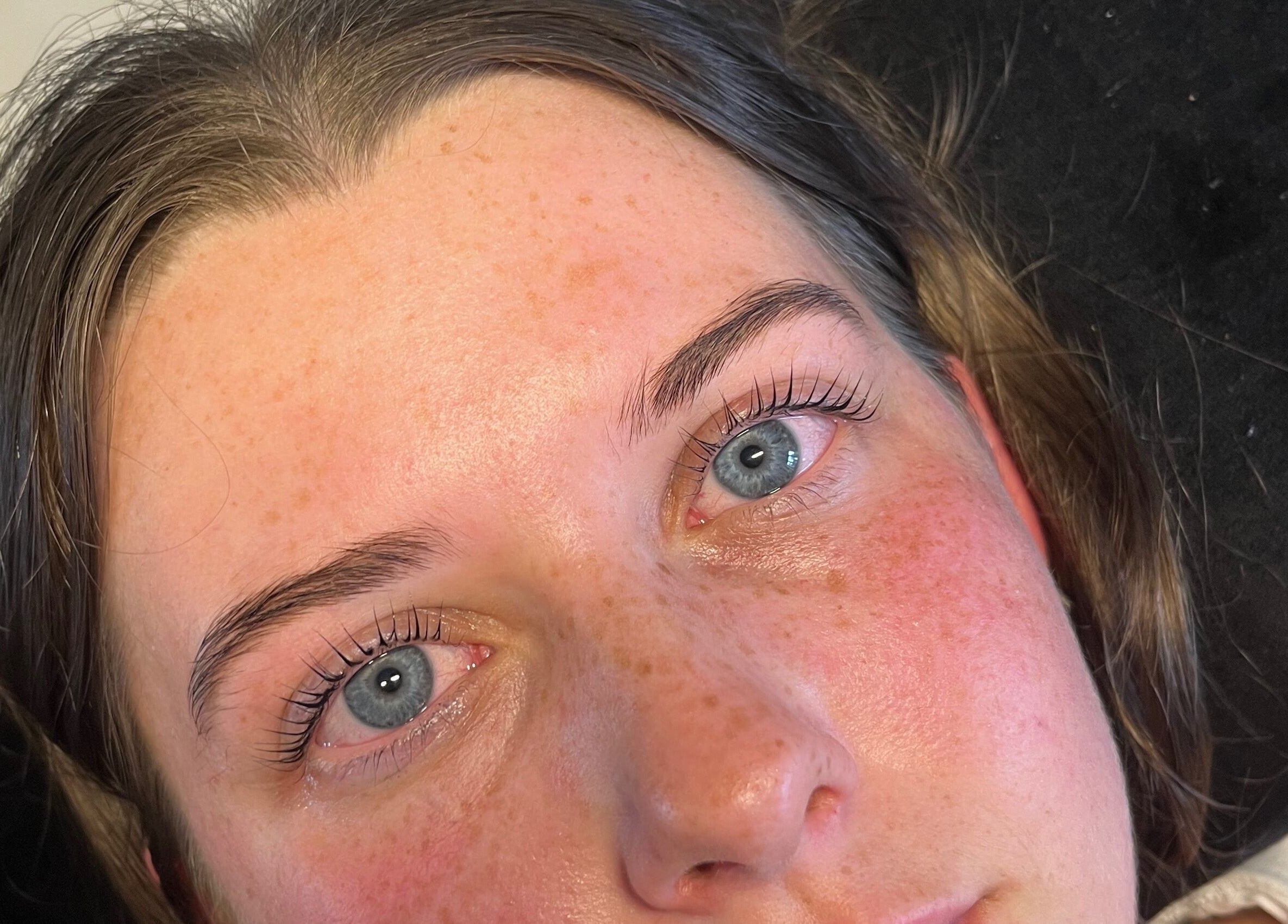 Close-up of enhanced lashes from Lashedbycharl, Manchester, England, GB, showcasing natural beauty.