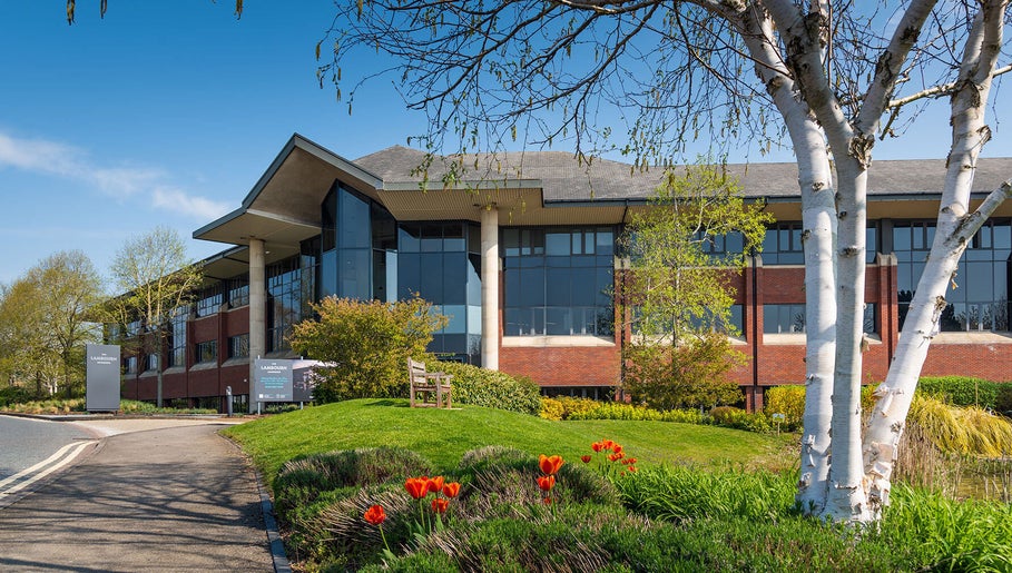 Exterior view of Reaction Therapy at Wyndyke Furlong, Abingdon, England, GB, amidst lush greenery.