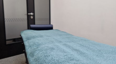 Massage table at Reaction Therapy in Wyndyke Furlong, Abingdon, ideal for appointments from 1st October 2025.