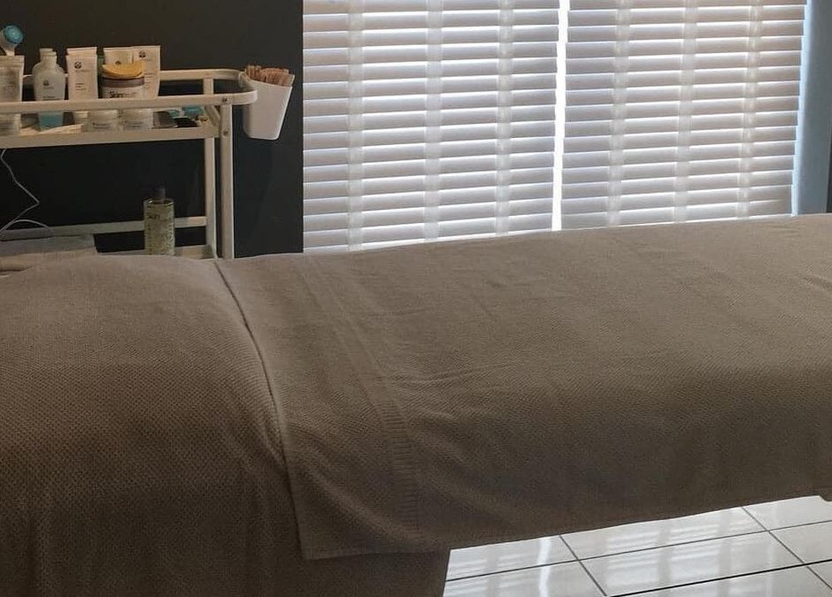 Relaxing therapy room at Elysian Therapies, South Ockendon, GB, featuring a comfortable massage table.