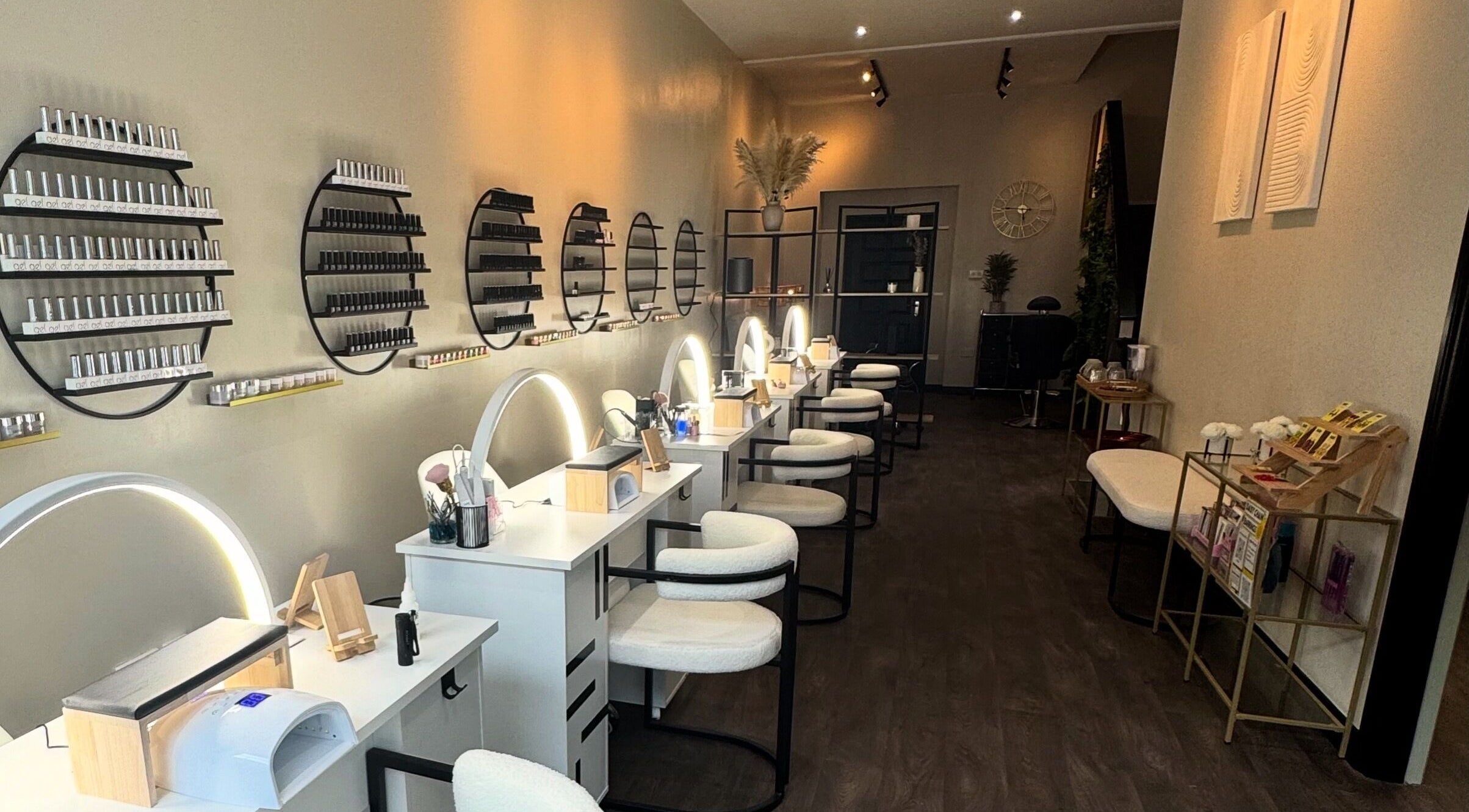 Chic interior of Bliss Body Bar, Ramsey, Ramsey, IM, showcasing modern beauty stations and calming decor.