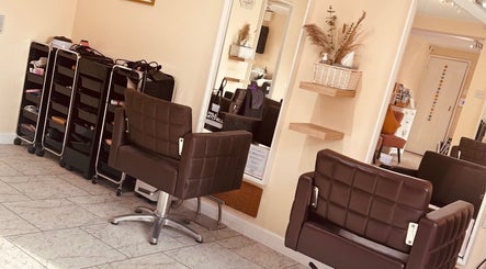 Bobbypins stylish salon interior with brown chairs and mirrors, Bromsgrove, England, GB.
