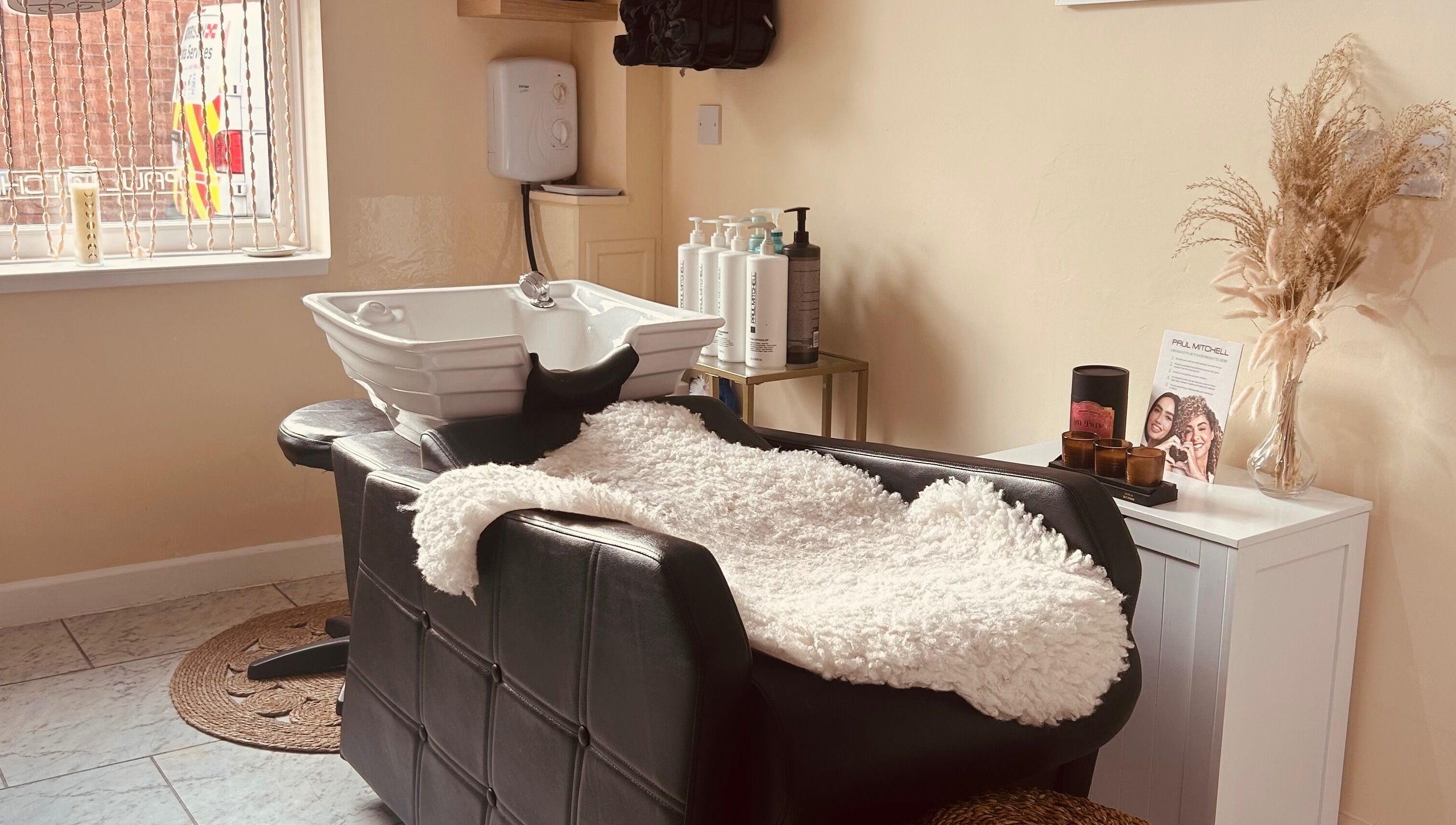 Cozy wash station at Bobbypins, Bromsgrove, England, GB, inviting new clients to relax and enjoy treatments.