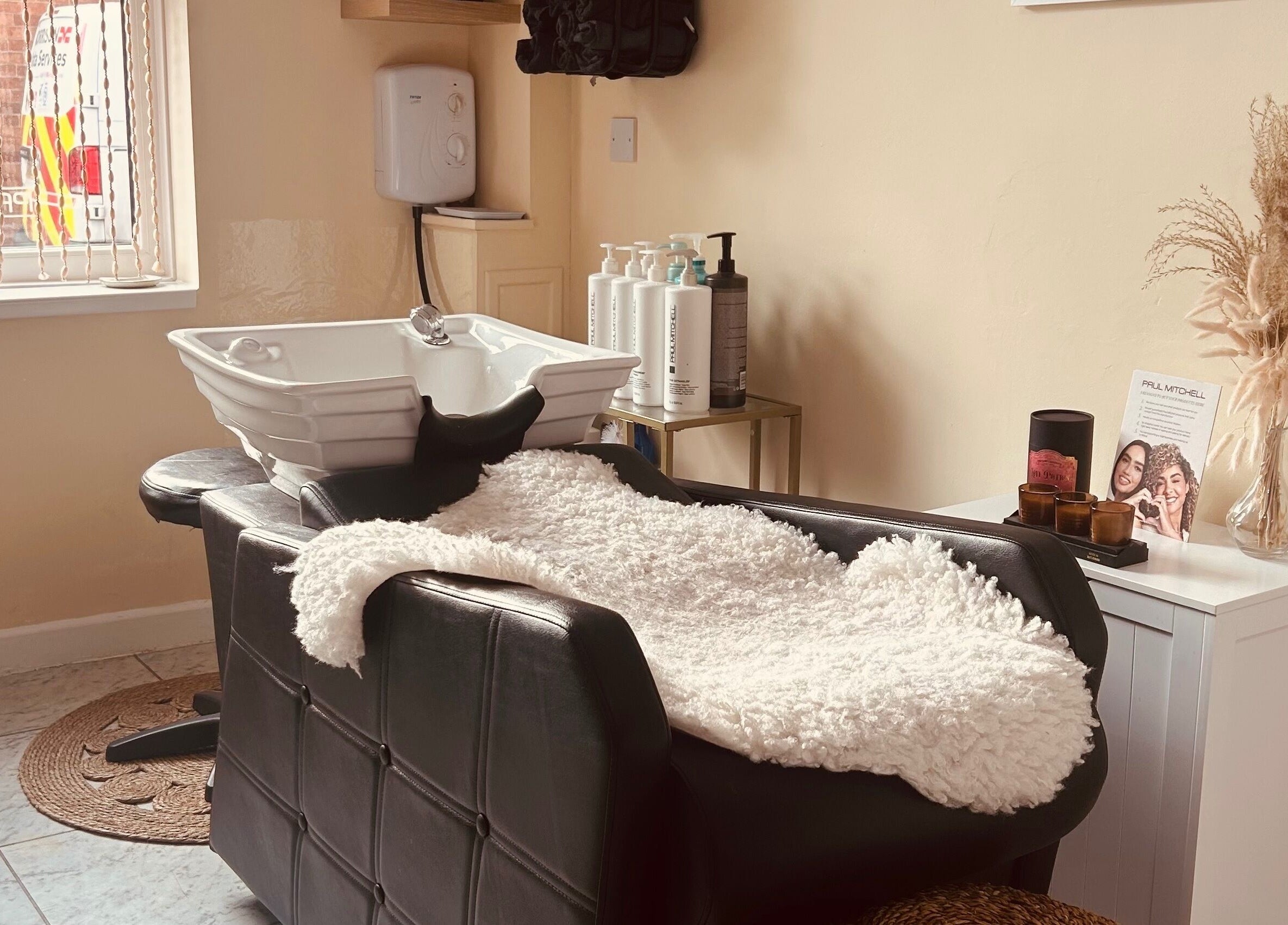 Cozy wash station at Bobbypins, Bromsgrove, England, GB, inviting new clients to relax and enjoy treatments.
