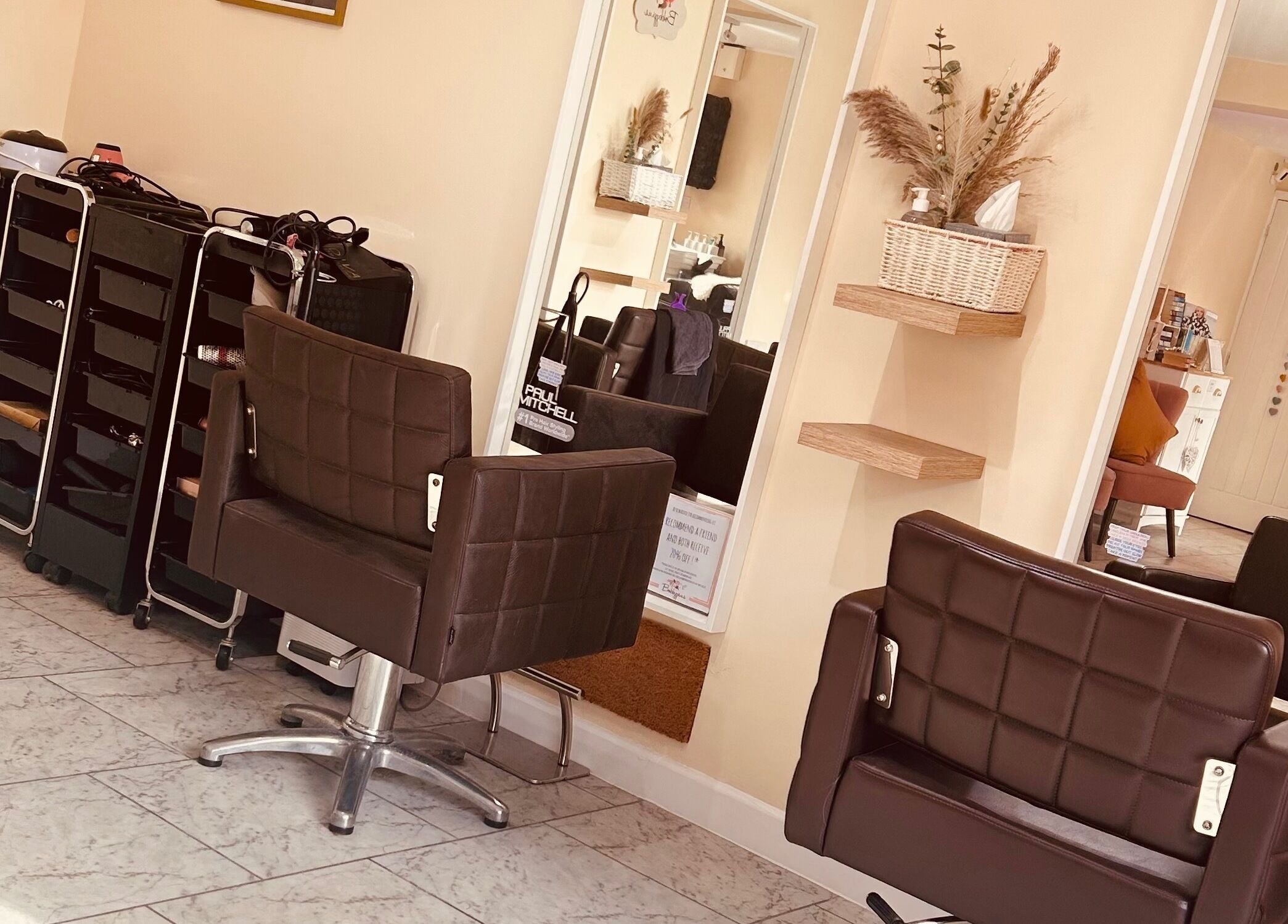 Inviting interior of Bobbypins salon in Bromsgrove, England. Modern chairs and decor create a welcoming vibe.