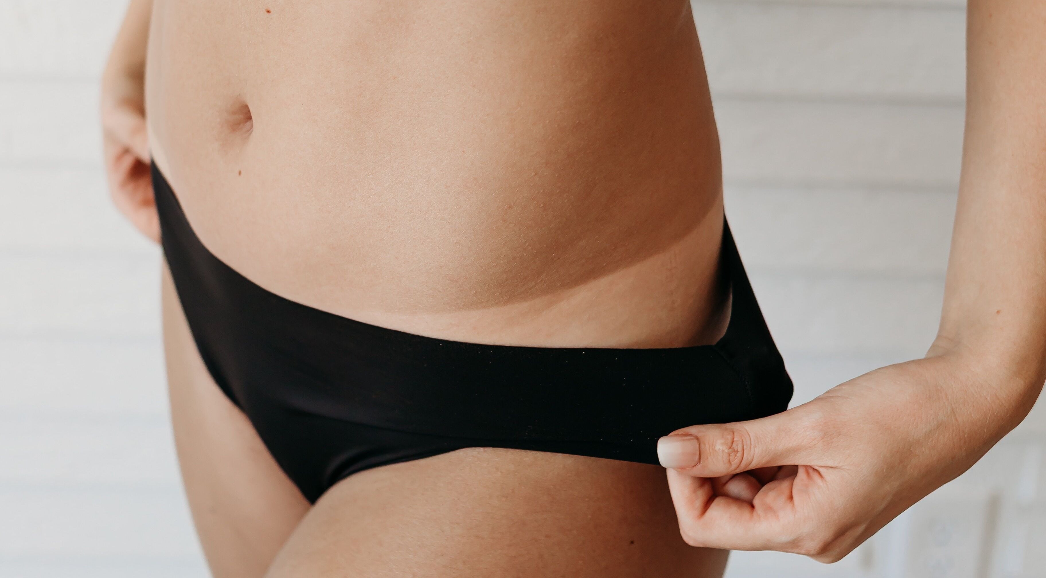 Close-up of chic black swimwear at Sprayed by Frazier Made, Oak Grove, Missouri, US.