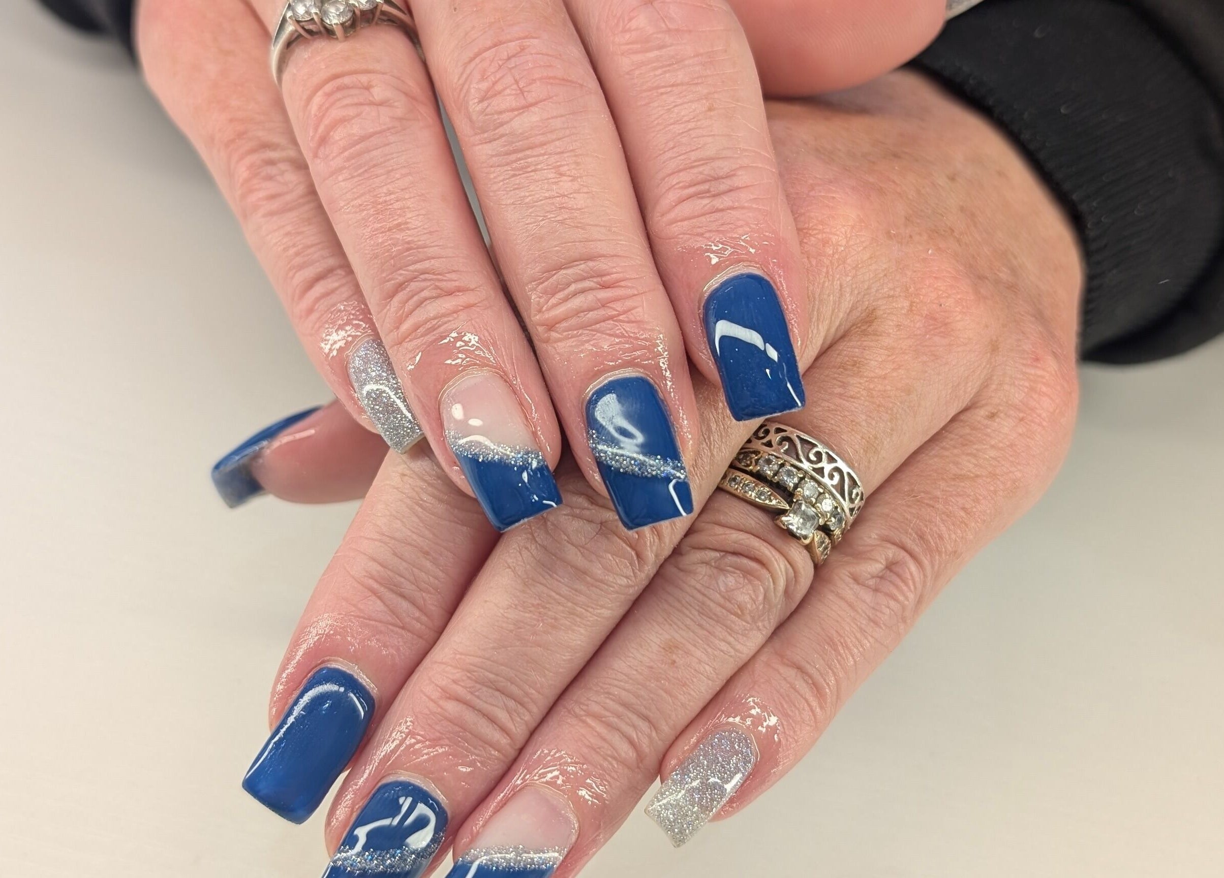 Elegant blue and silver nail art at Beyond Beauty, Blyth, England, GB.