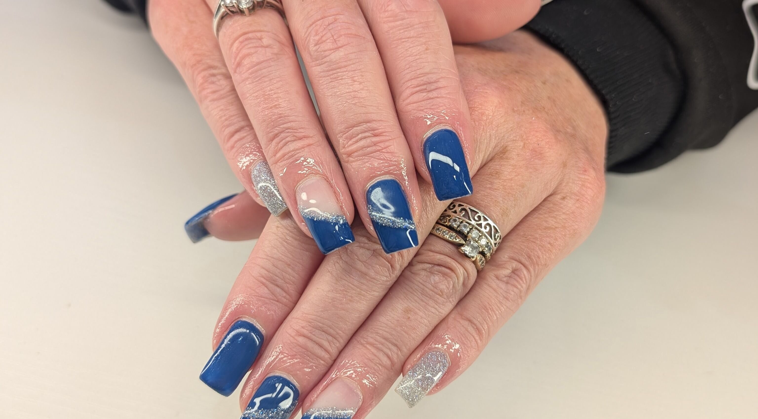 Elegant blue and silver nail art at Beyond Beauty, Blyth, England, GB.