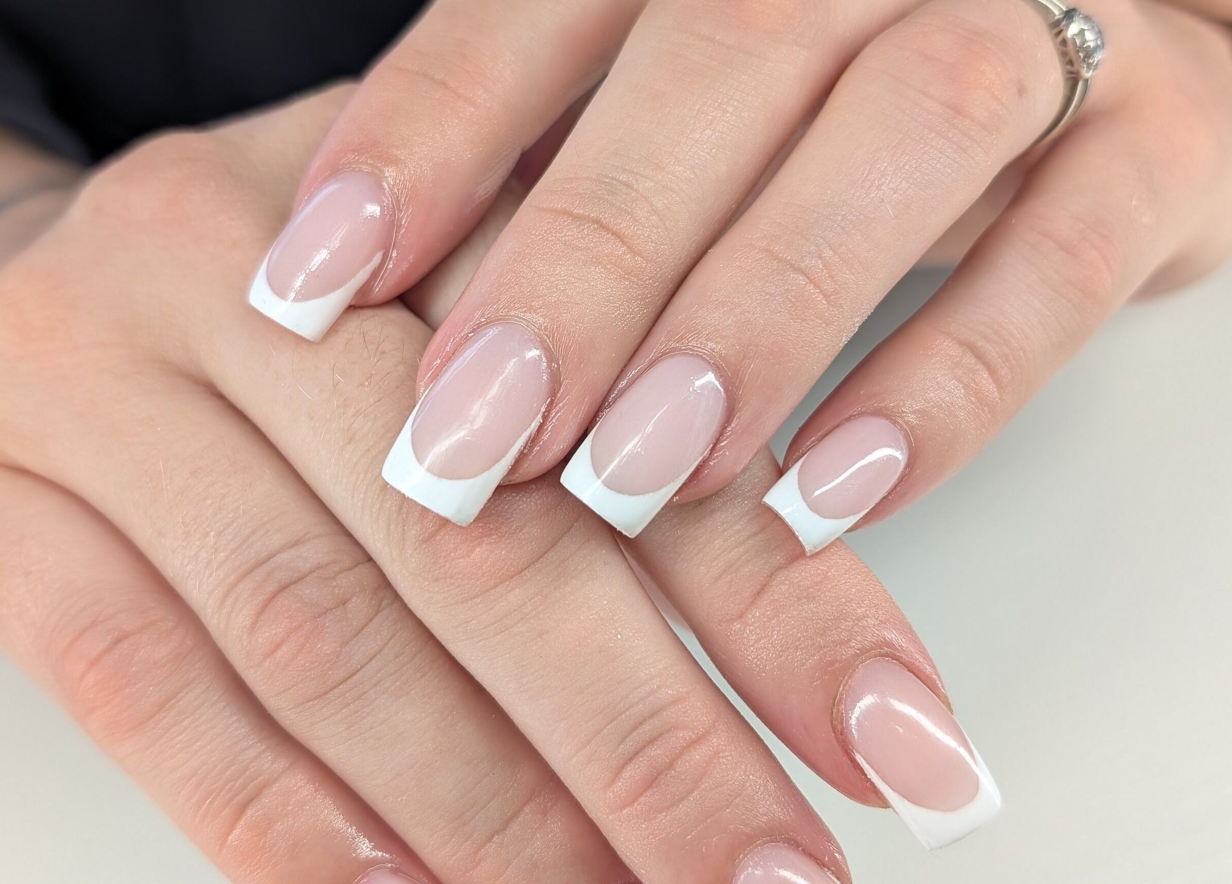 Elegant French manicure at Beyond Beauty, Blyth, England, GB, showcasing expertly polished nails.