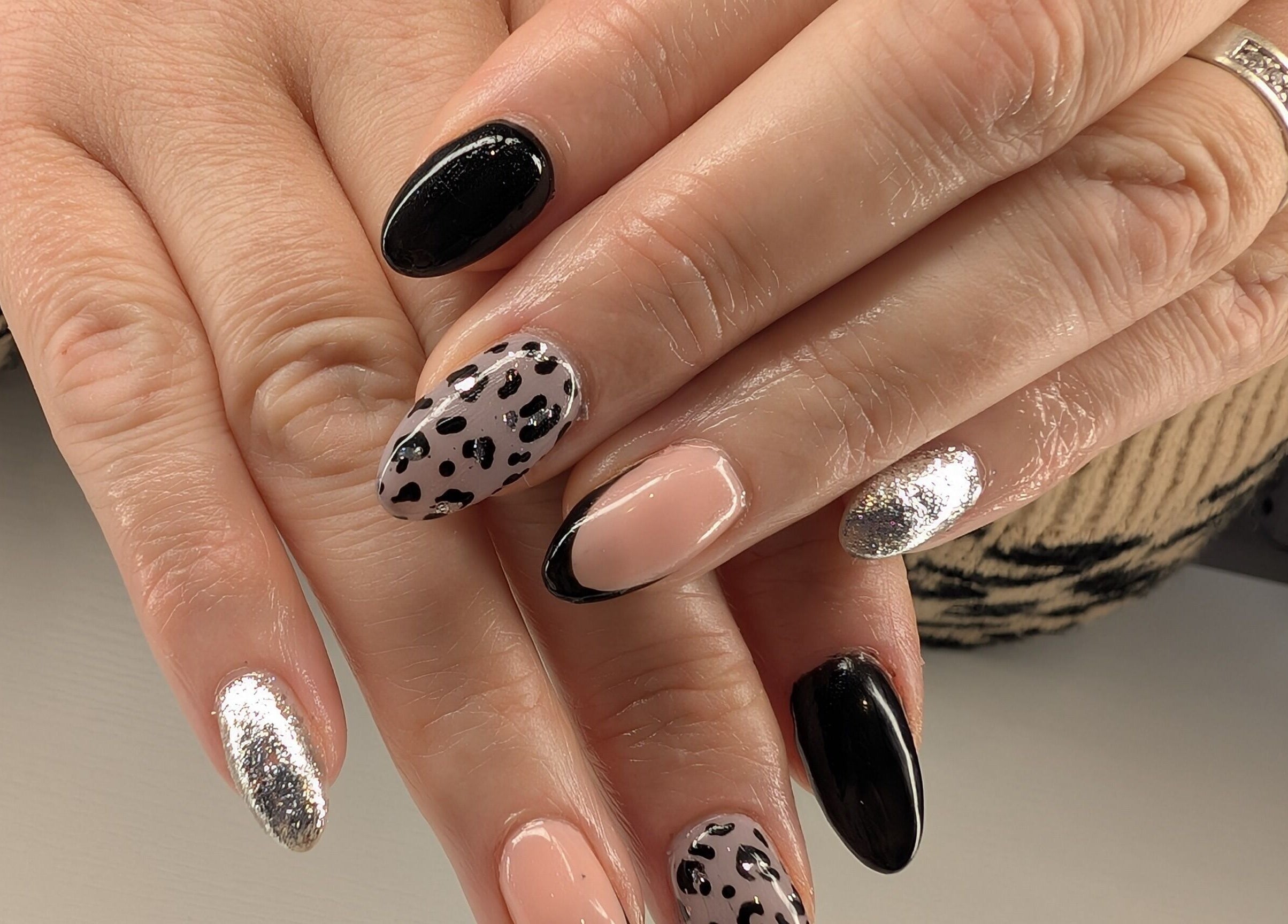 Stylish black and silver nail art at Beyond Beauty, Blyth, England, GB showcasing elegance and creativity.