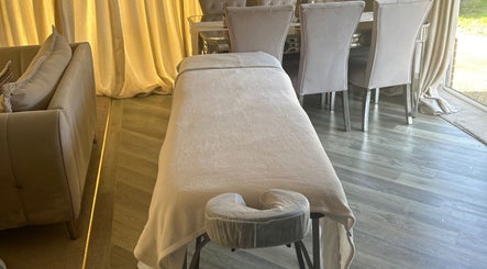 Luxurious massage table at Elite Massage Kent, Rochester, England, GB, in tranquil setting.