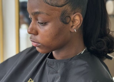 A client with a stylish hairstyle at Romaiya Beauty Bar, London, England, GB.