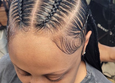 Intricate braid styling at A'daora Trichology & Wellness Inst., Towson, Maryland, US.