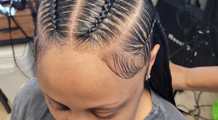 Intricate braid styling at A'daora Trichology & Wellness Inst., Towson, Maryland, US.