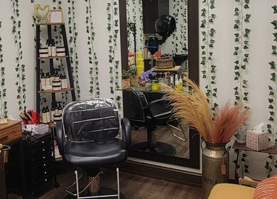 Cozy styling chair and plants at A'daora Trichology & Wellness Inst., Towson, Maryland, US.