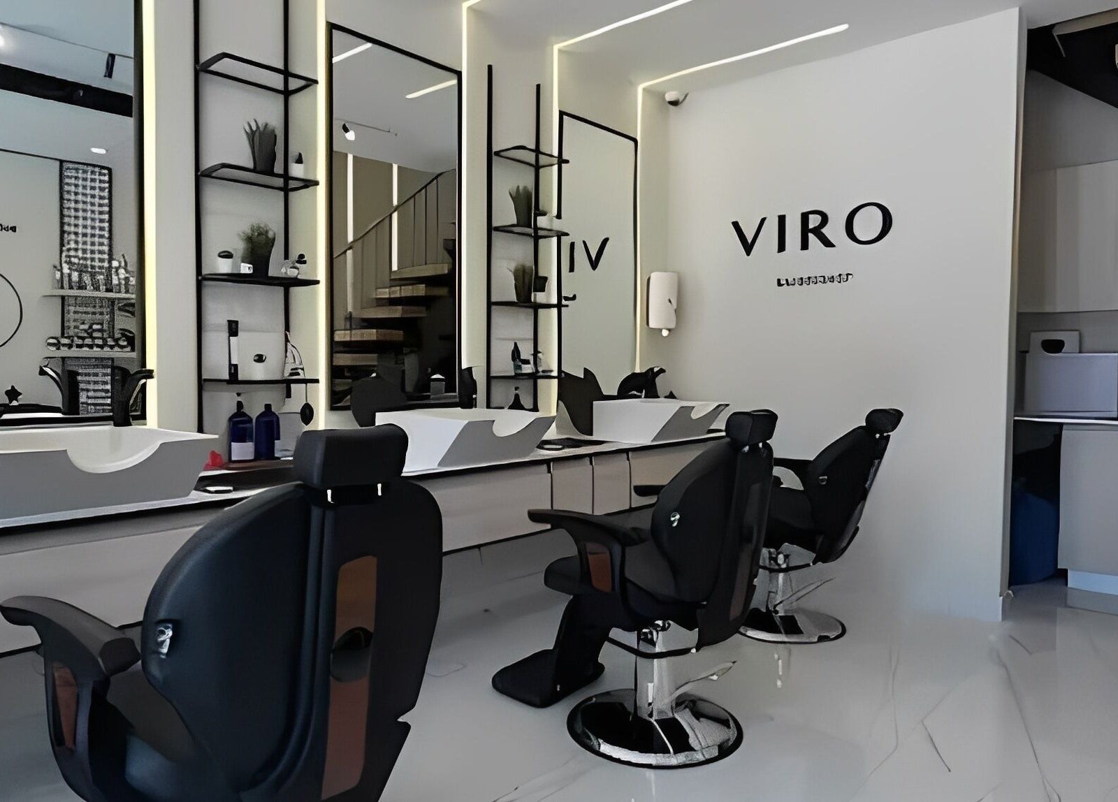 Modern interior of VIRO Barbershop - AL Nakheel, Amman with sleek design and comfortable chairs.