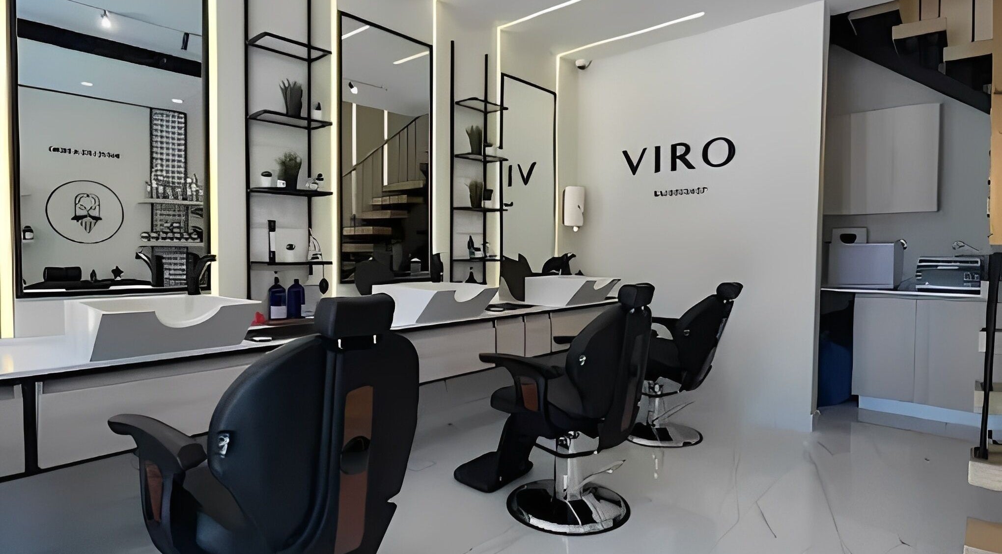Modern interior of VIRO Barbershop - AL Nakheel, Amman with sleek design and comfortable chairs.