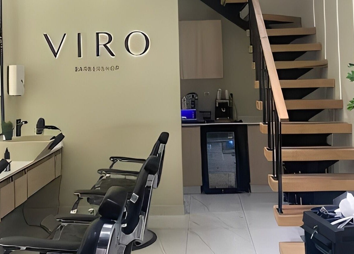 Modern interior of VIRO Barbershop - AL Nakheel featuring sleek barber chairs and stylish decor in Amman, JO.