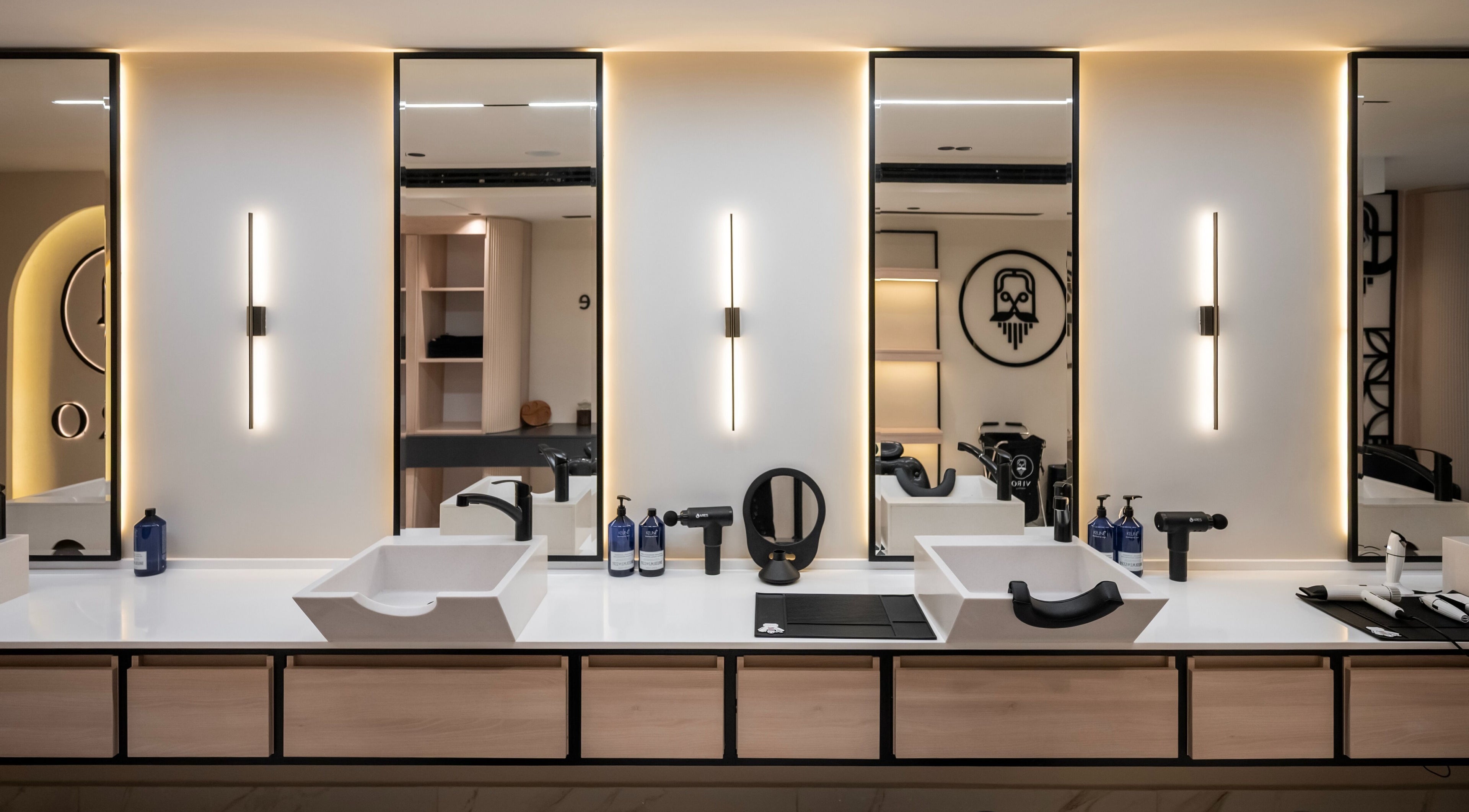 VIRO Barbershop Dabouq interior showcases sleek design in Amman, Amman Governorate, JO with modern styling stations.