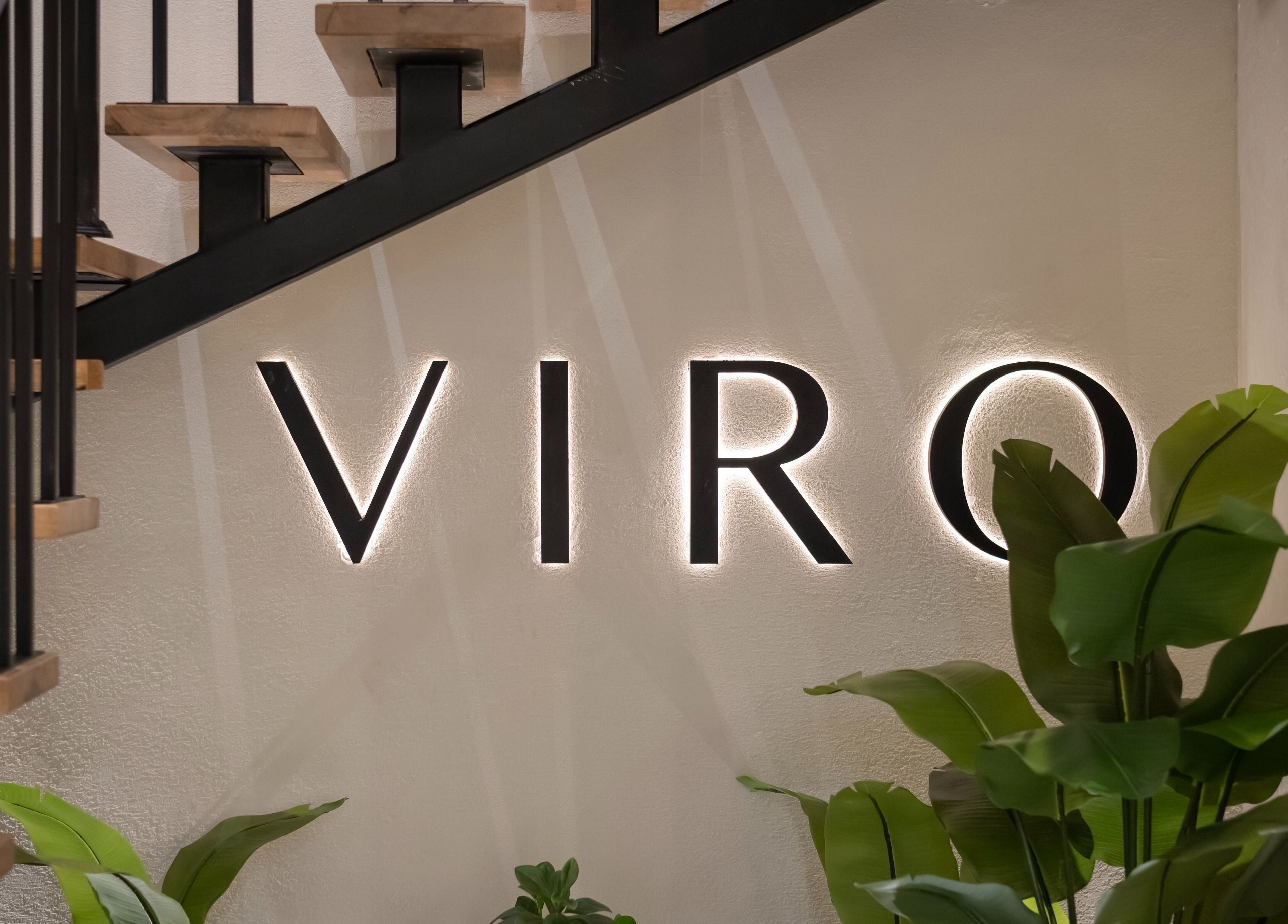 VIRO Barbershop Dabouq entrance sign with plants in Amman, Amman Governorate, JO.