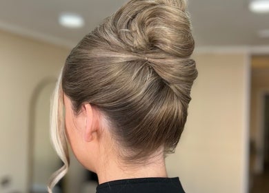 Elegant updo hairstyle at SUL in Prestwich, England, GB. Perfect for special occasions.