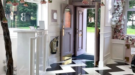 Chic entrance at Samantha’s Skin Clinic, Failsworth, England, GB, featuring floral decor and modern design elements.