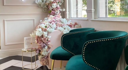 Luxurious seating with lush floral decor at Samantha’s Skin Clinic, Failsworth, England, GB. Perfect relaxation spot.