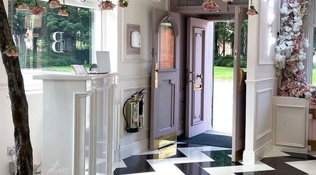 Exquisite entrance at Samantha's Skin Clinic, Failsworth, England, GB with floral decor and sunlight.