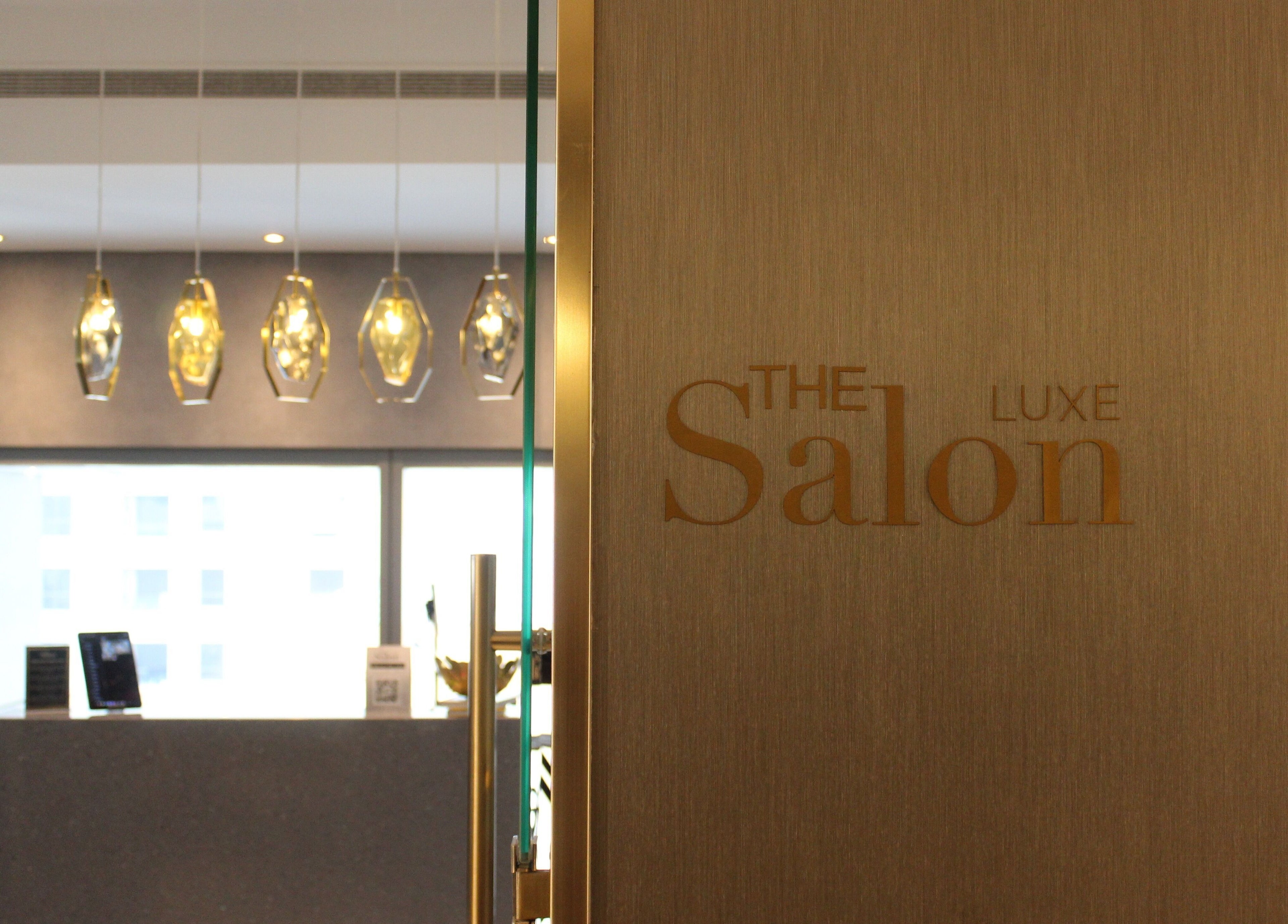 Elegant entrance of The Salon Luxe at Five JBR in Dubai, AE, showcasing modern design and stylish lighting.