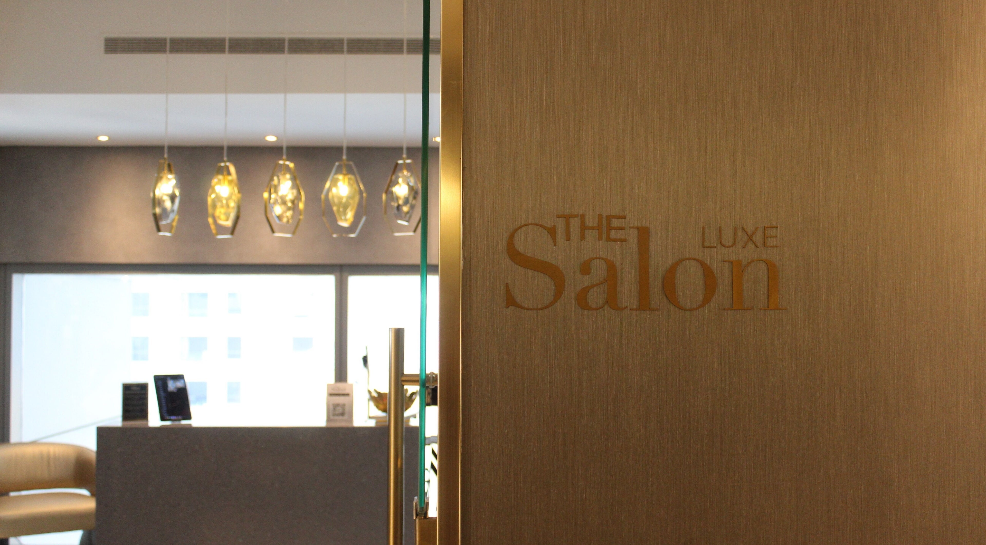 Elegant entrance of The Salon Luxe at Five JBR in Dubai, AE, showcasing modern design and stylish lighting.