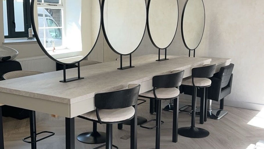 Modern salon interior with styling chairs and mirrors at Glam by Laura, Sheffield, England, GB.