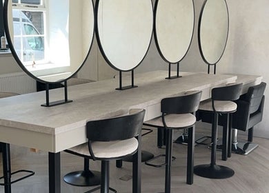 Modern salon interior with styling chairs and mirrors at Glam by Laura, Sheffield, England, GB.