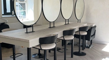 Modern salon interior with styling chairs and mirrors at Glam by Laura, Sheffield, England, GB.