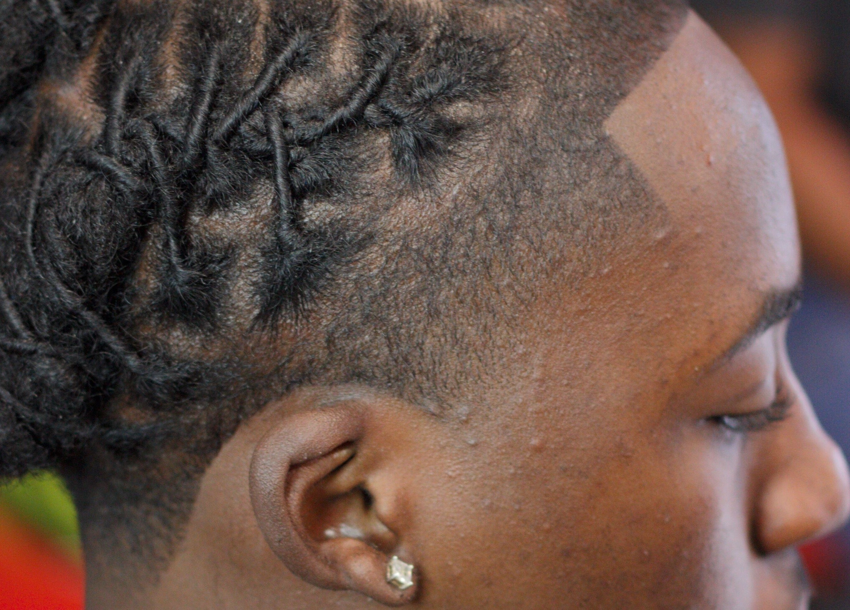 Intricate dreadlock styling at Rick Blndz, Nassau, New Providence, BS.