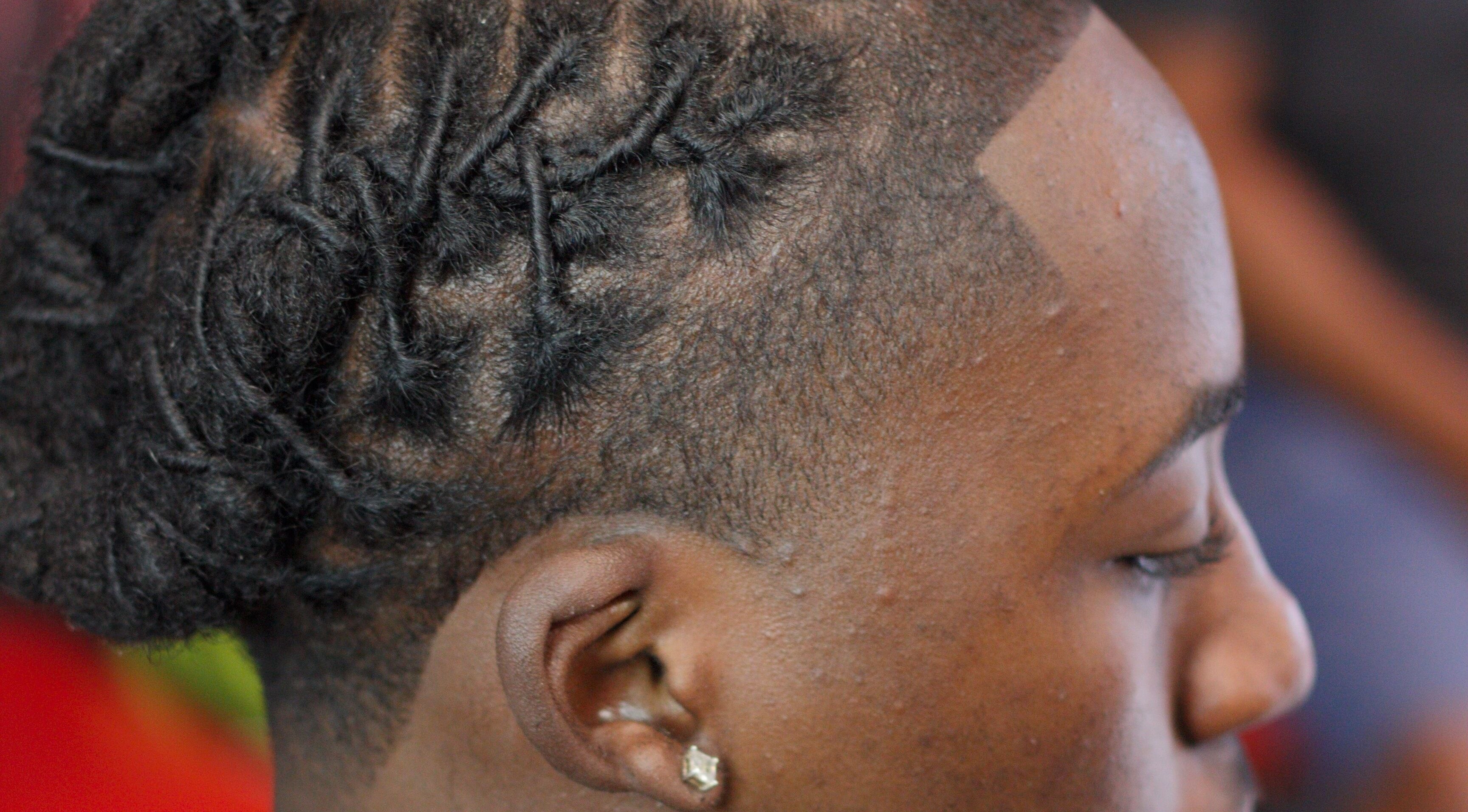 Intricate dreadlock styling at Rick Blndz, Nassau, New Providence, BS.