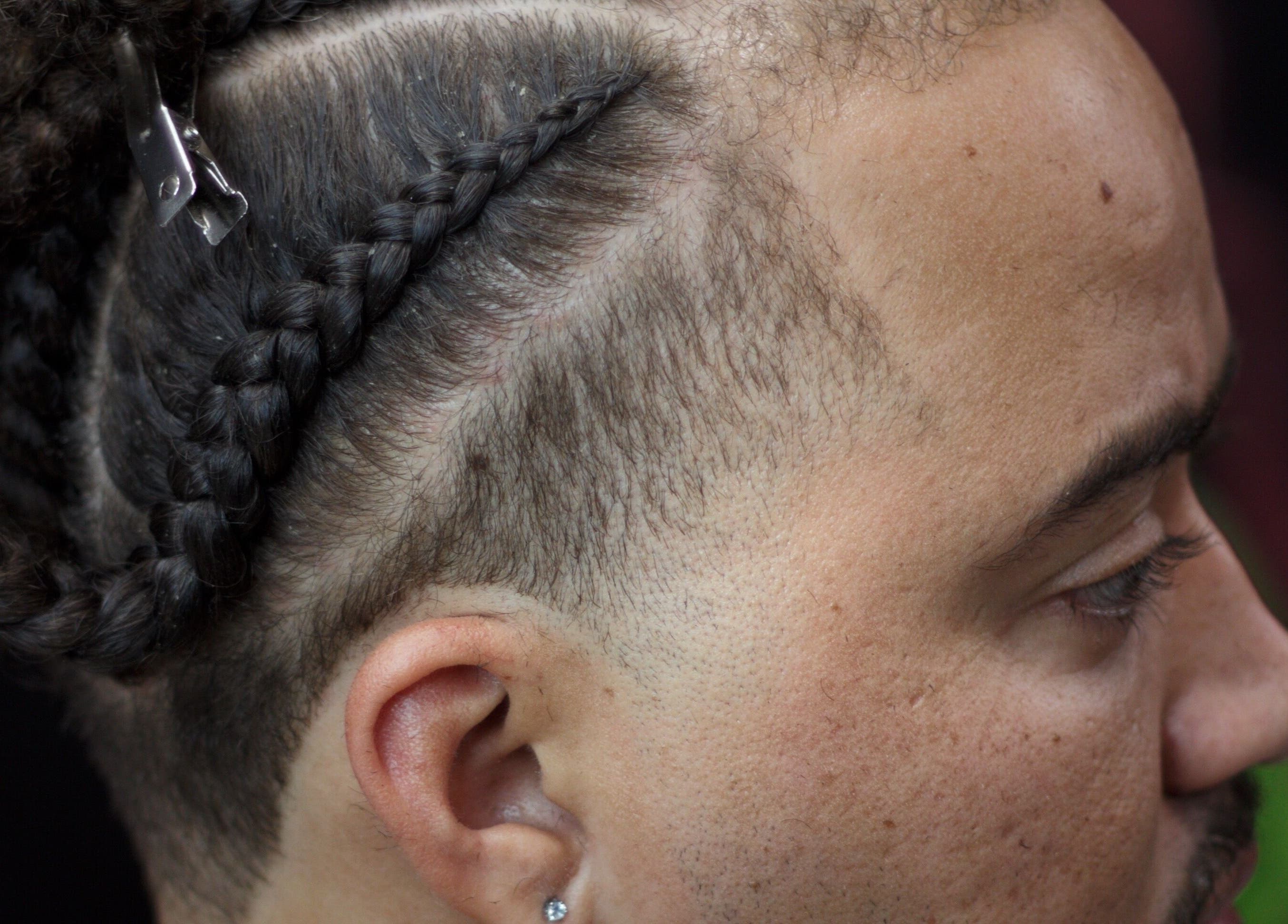 Close-up of braided hairstyle at Rick Blndz, Nassau, New Providence, BS.