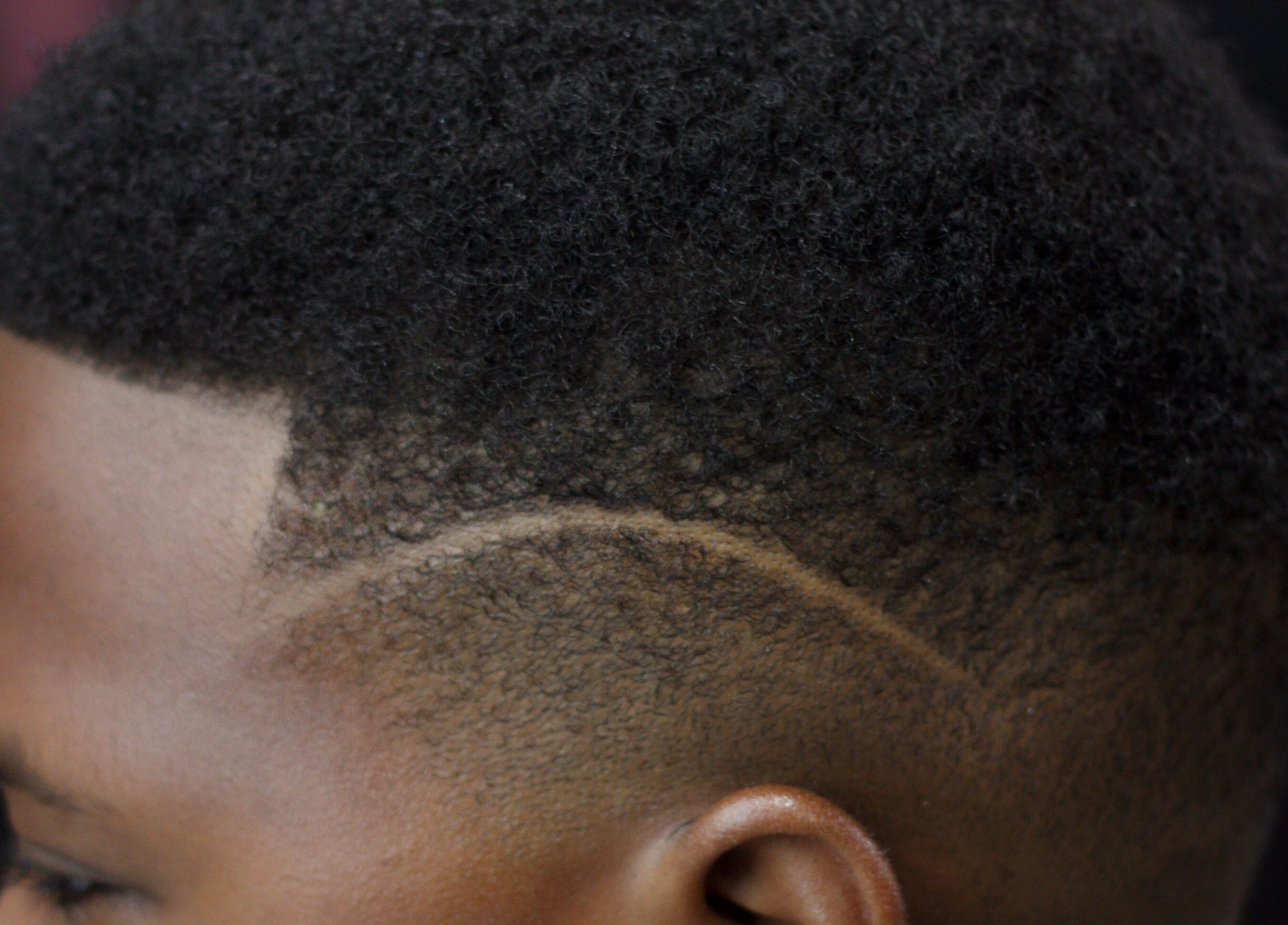 Close-up of sleek hair design at Rick Blndz, Nassau, New Providence, BS.